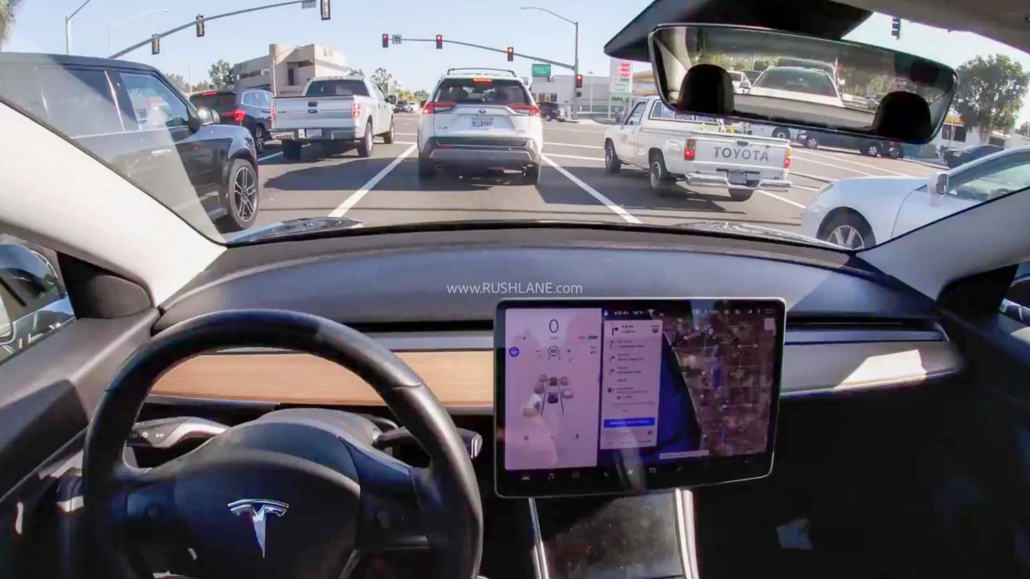 Tesla stops at traffic signal
